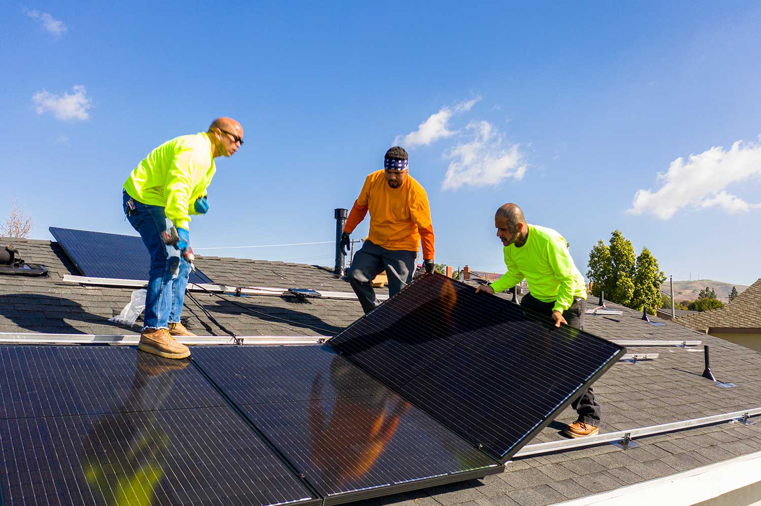 ECS employees laying solar panels