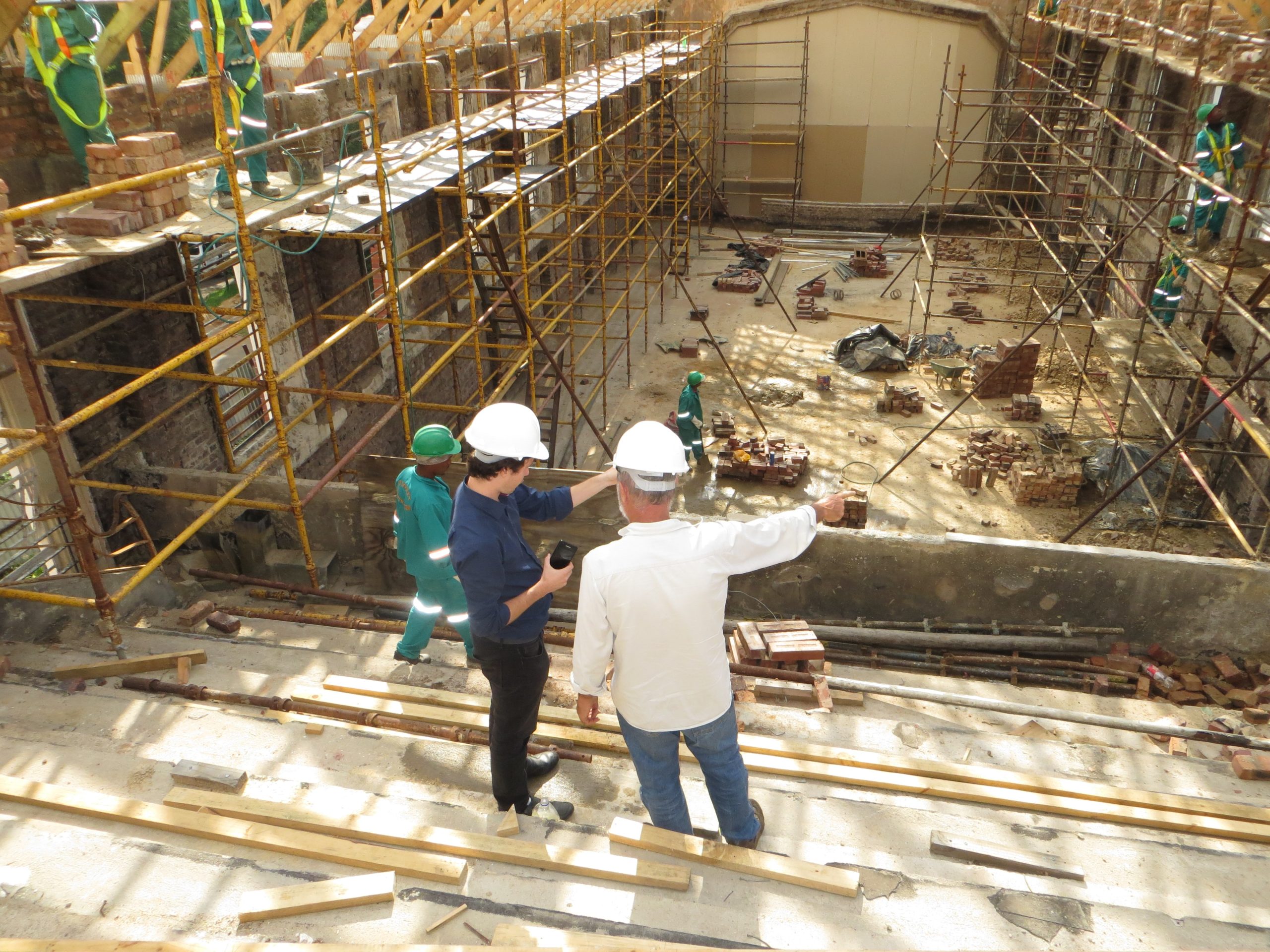 engineers talking over plans