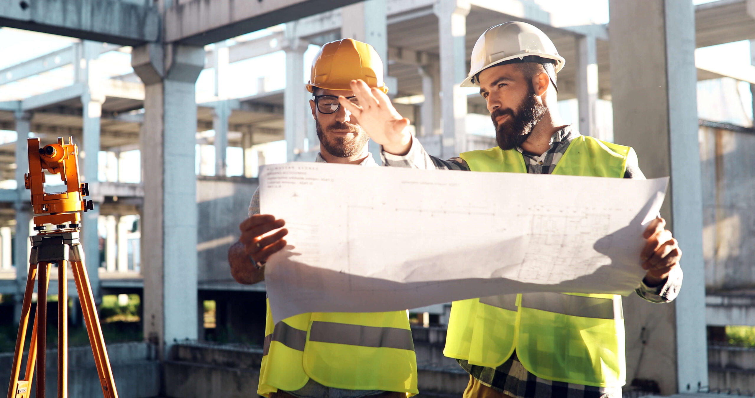 two engineers reviewing plans