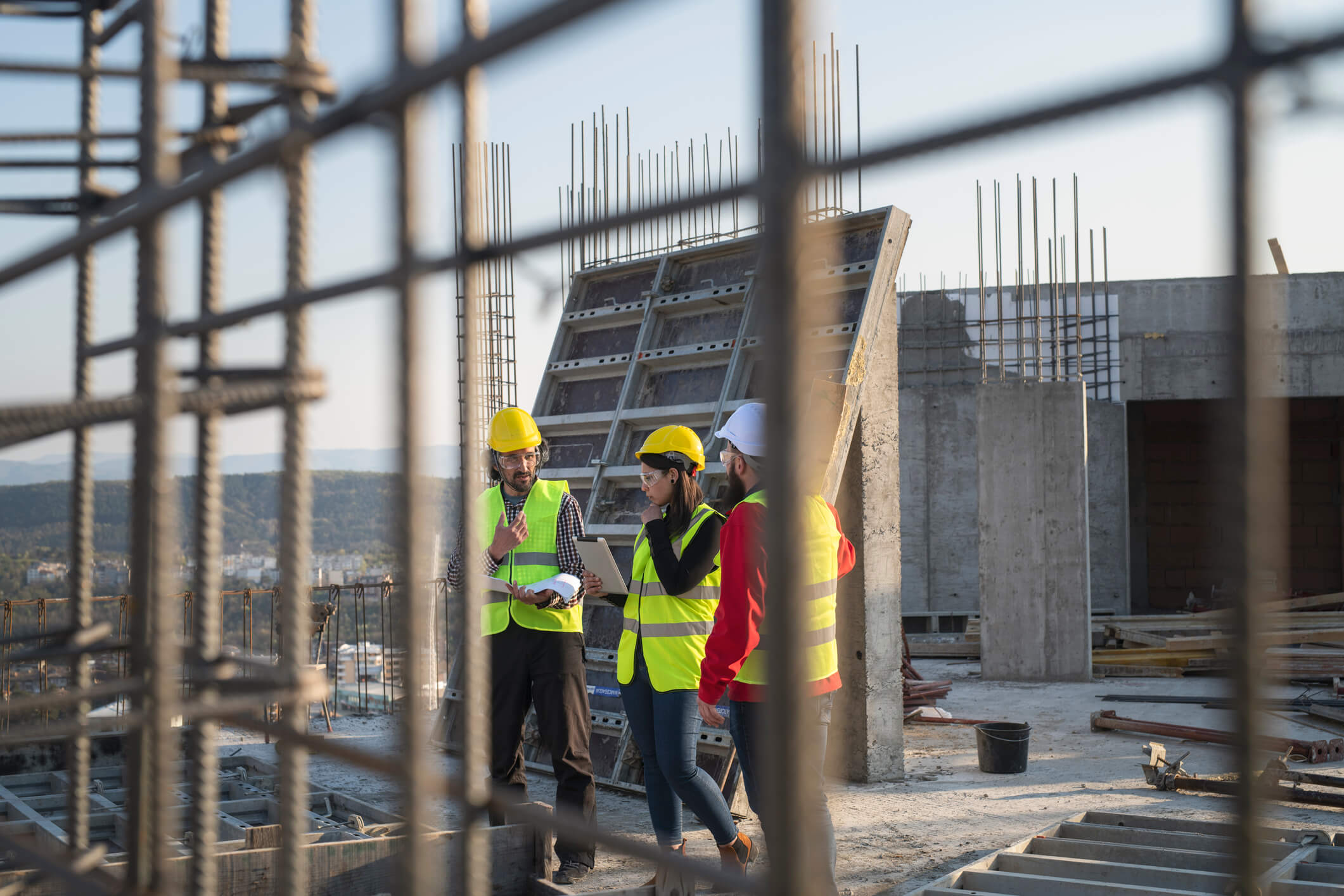 three engineers discussing construction plans