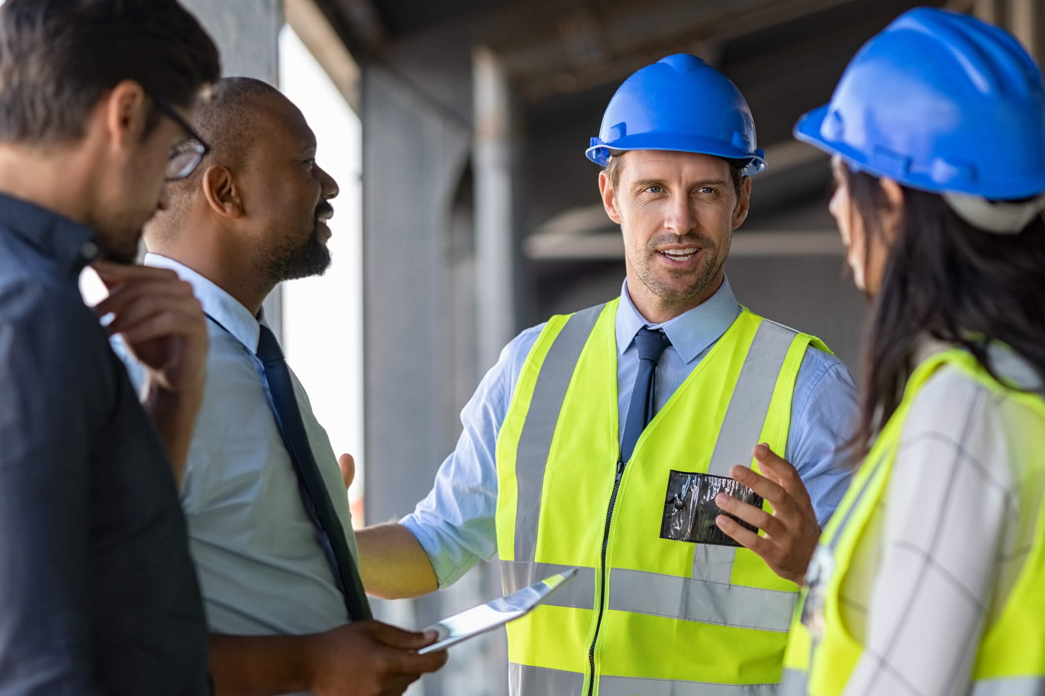 construction team talking over structural plans