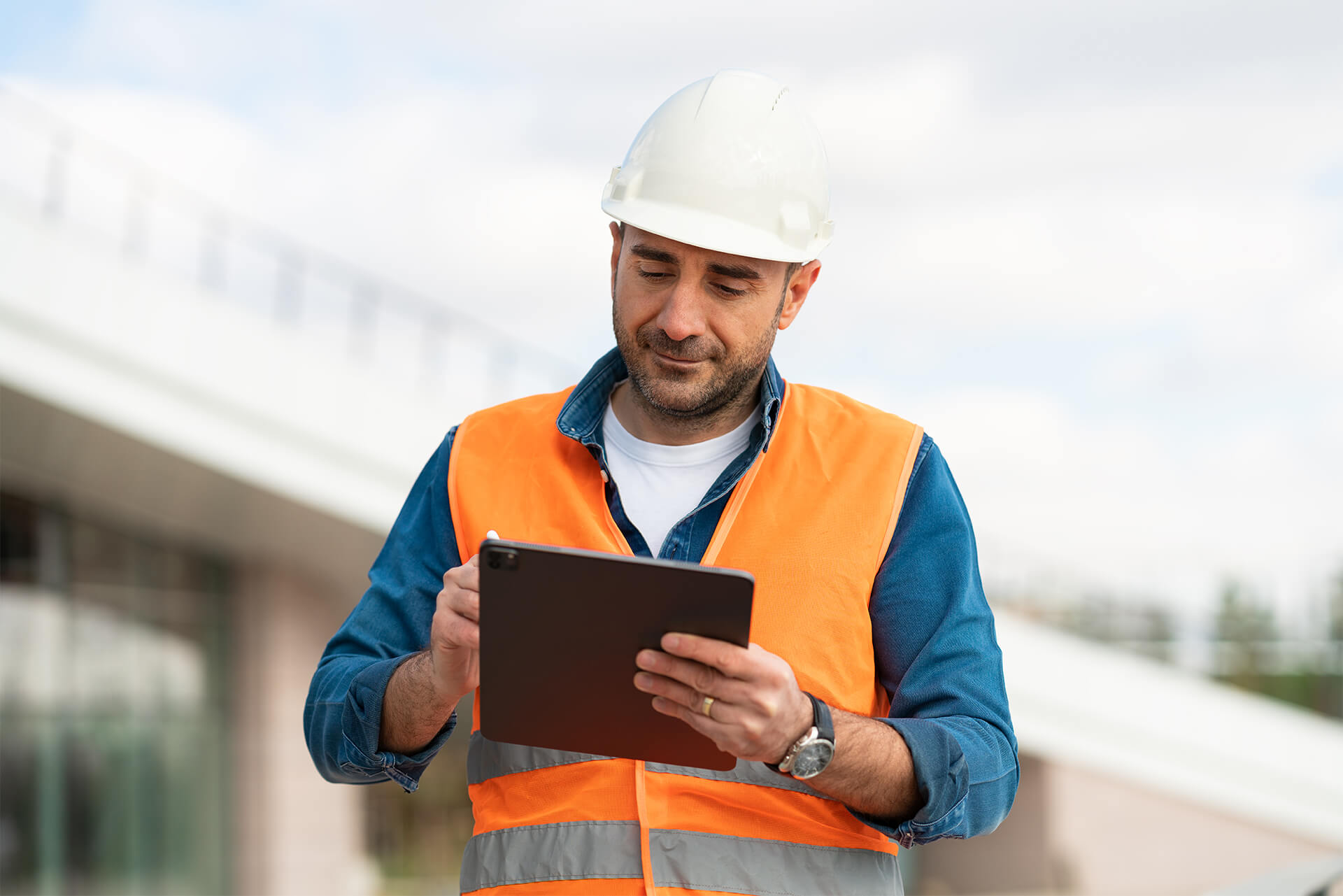 engineer writing on a tablet