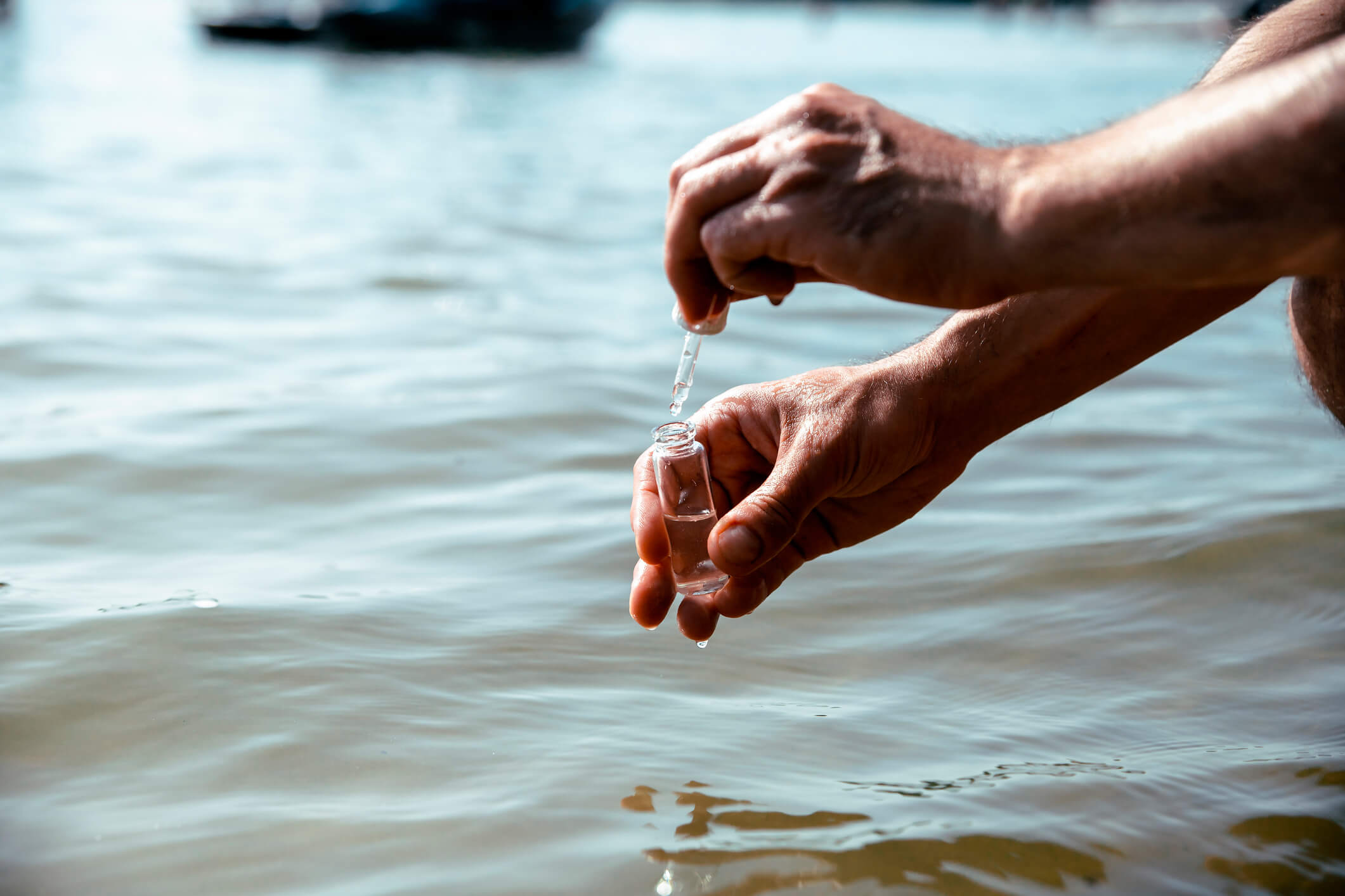 engineer collecting water sample