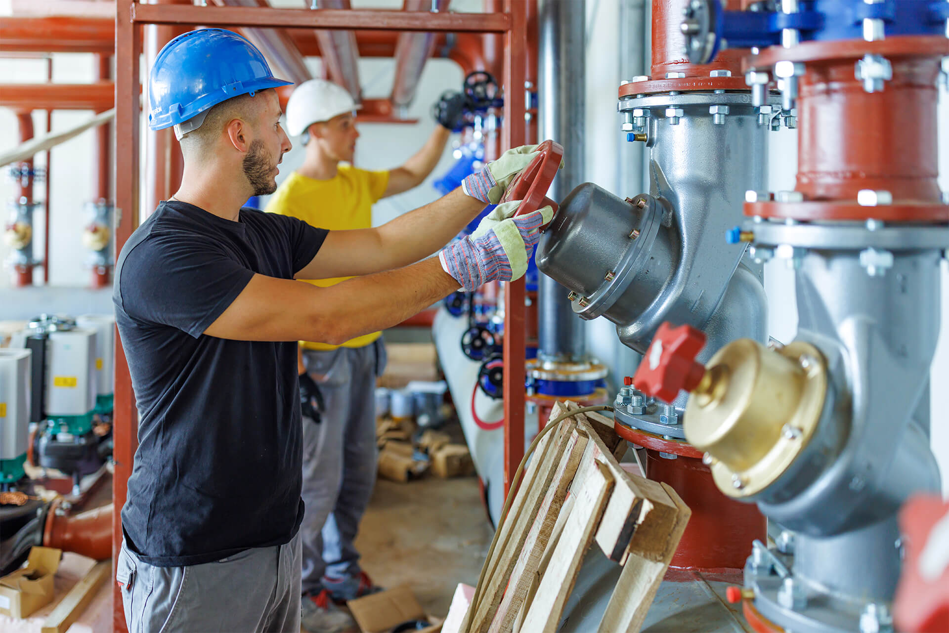 engineers turning valve