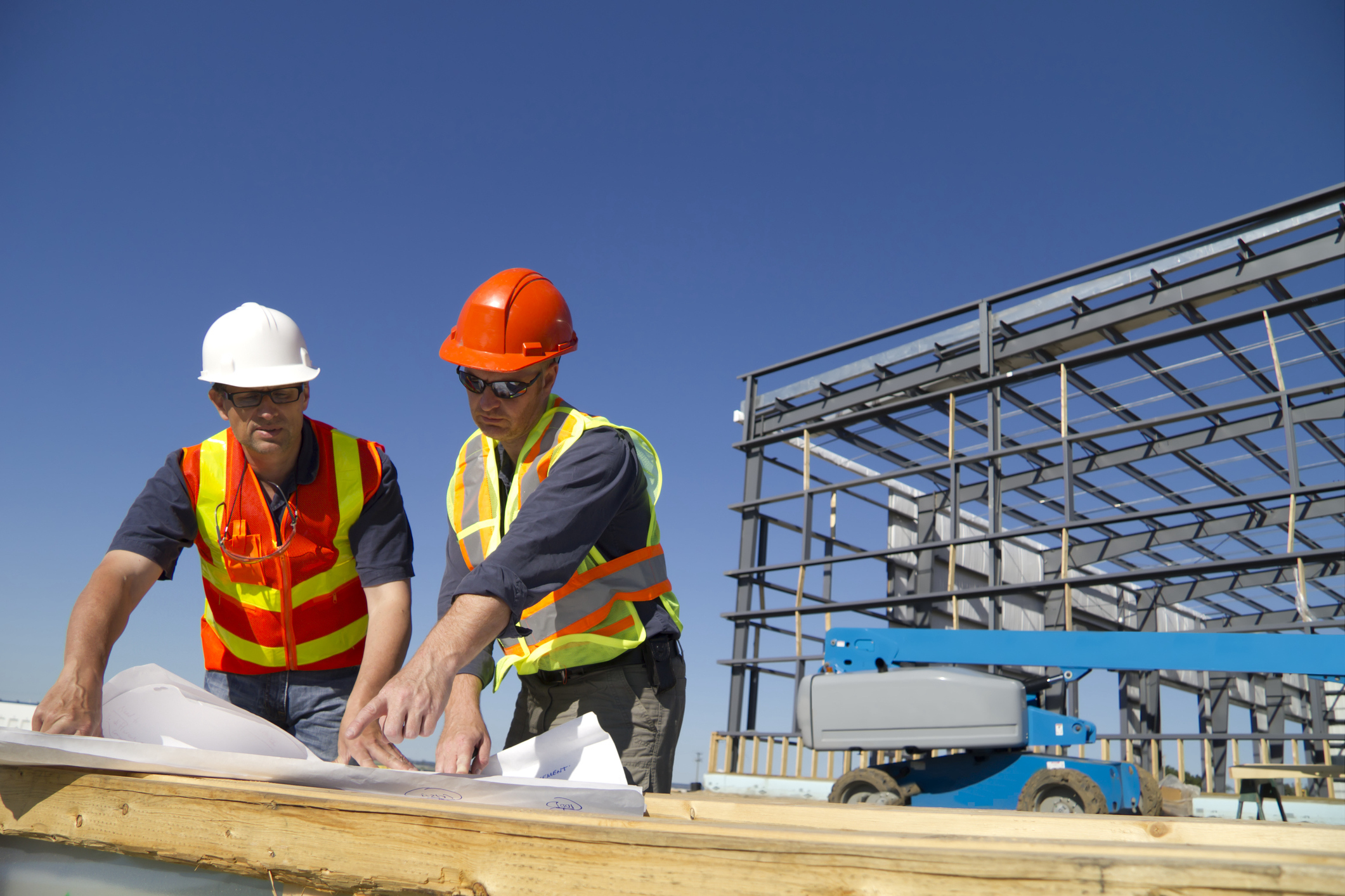 two engineers discussing plans