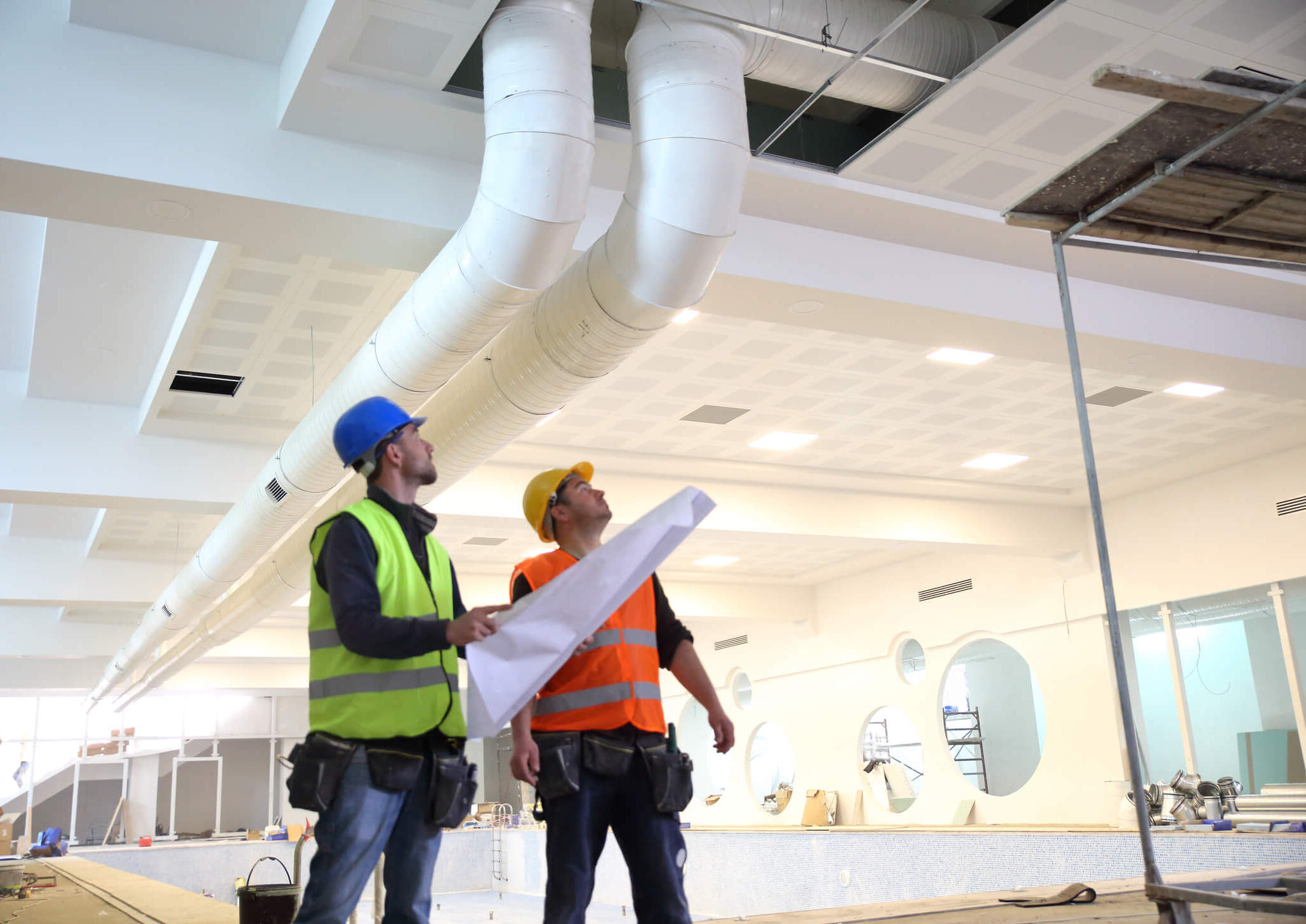 two engineers analyzing ceiling