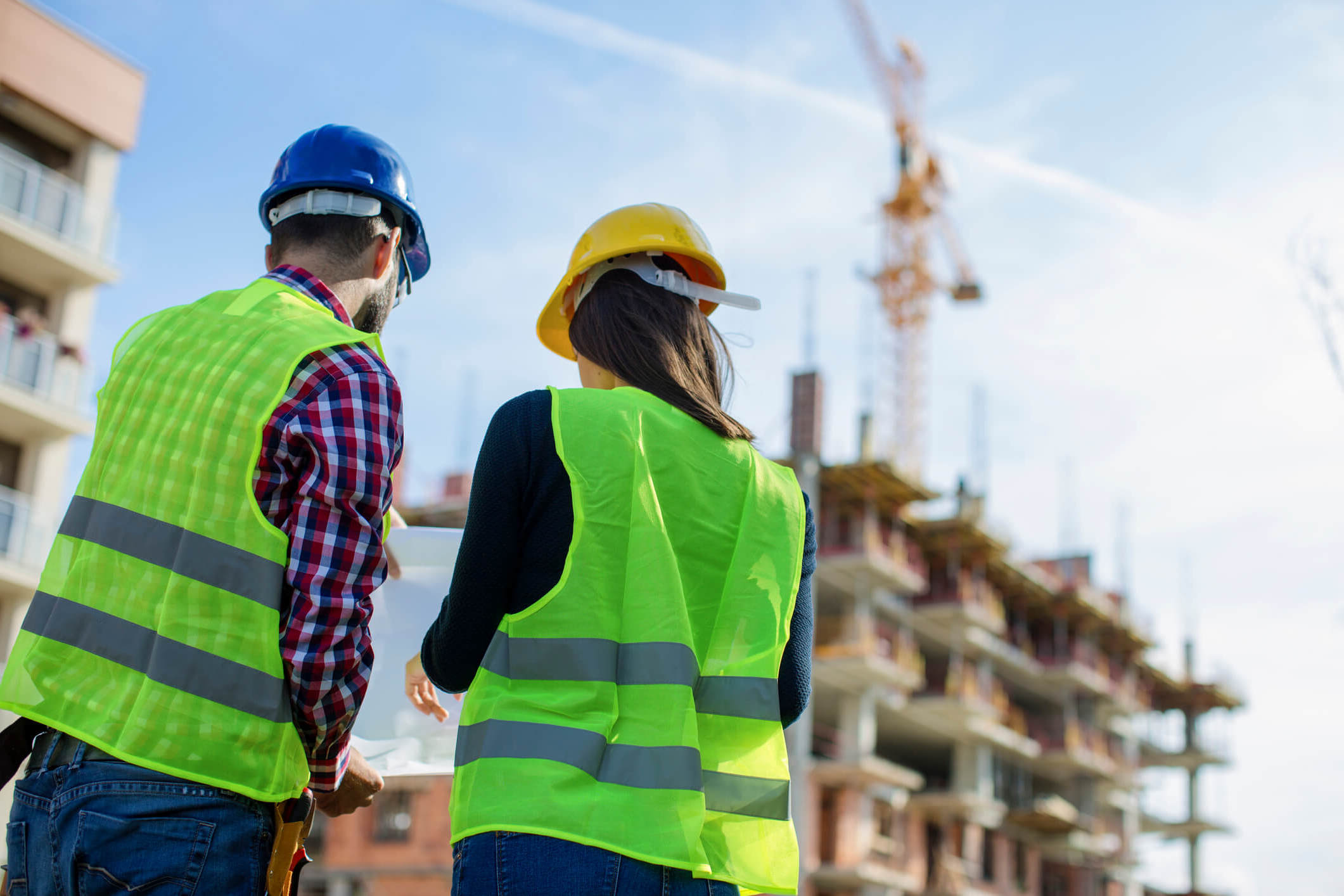 two engineers reviewing plans