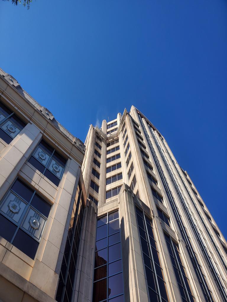 Photo of power washing the deco facade of the Wells Fargo Tower.