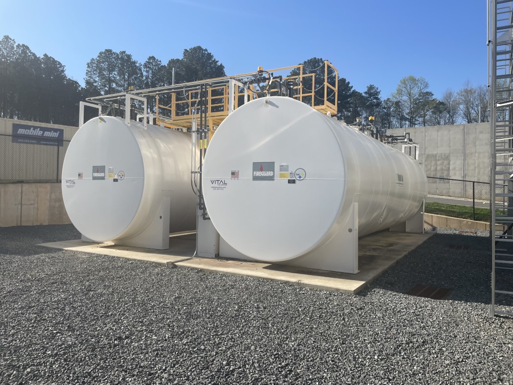 Photo of double-walled aboveground storage tanks (ASTs), designed to prevent leaks and spills, supporting spill prevention and containment measures required by environmental compliance services.
