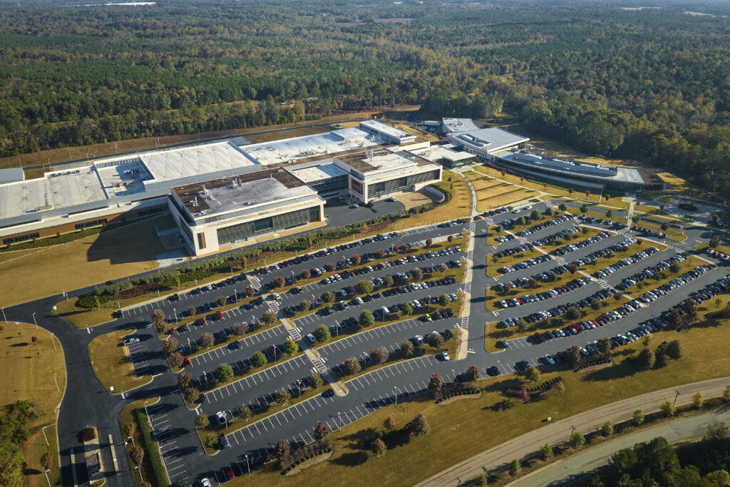 aerial view of many employee cars parked on parkin 2026 01 07 01 58 46 utc